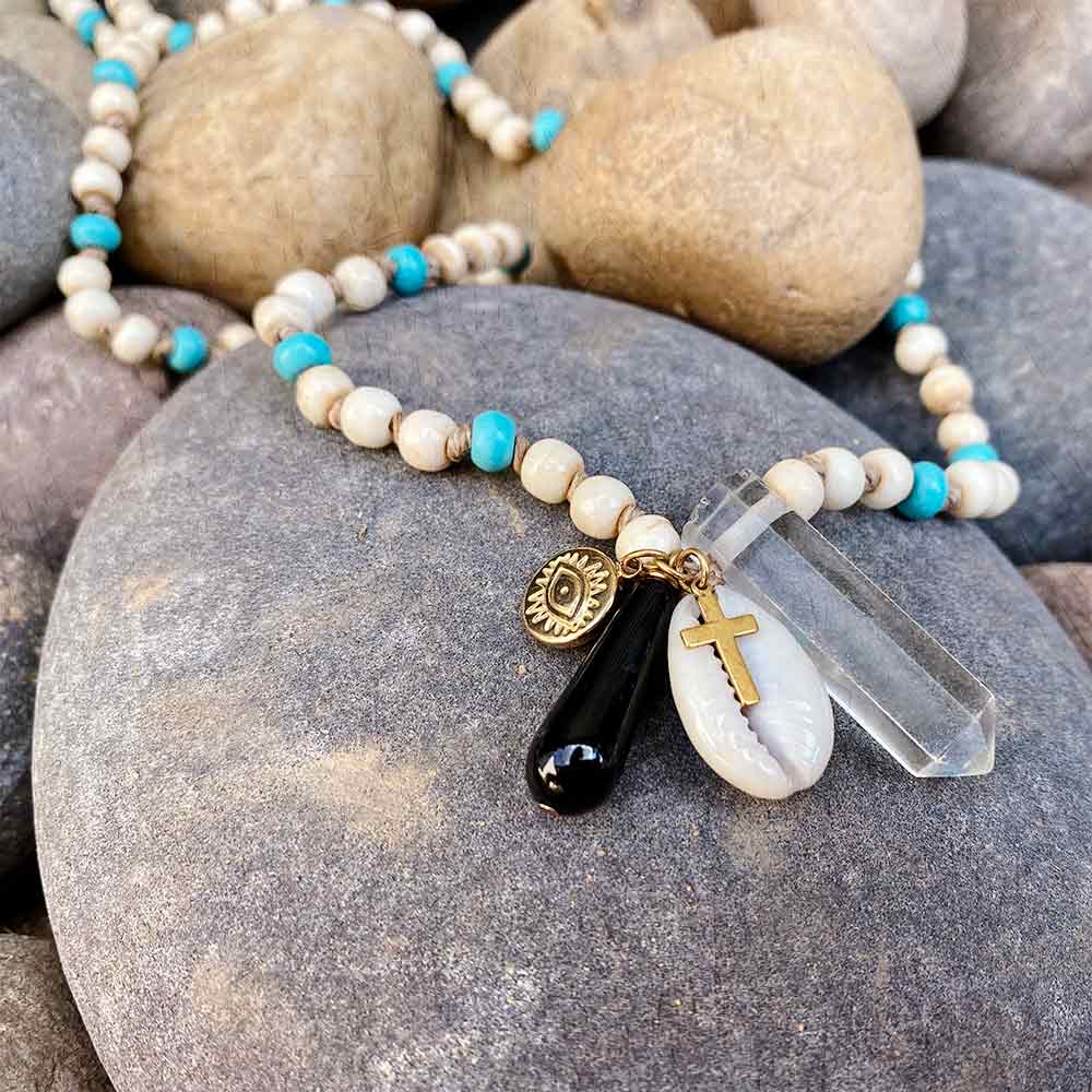 Alt="E.B. Jewelry Studio Women's Handcrafted Bone, Turquoise, Cowrie Shell, Onyx, Selenite, Gold Evil Eye and Religious Cross Charms Talisman Necklace"